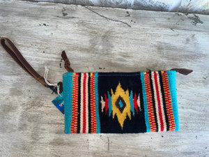 front of blue, red, and turquoise wristlet