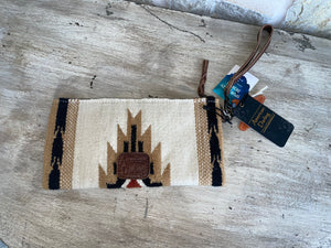 back of cream and brown wristlet/clutch