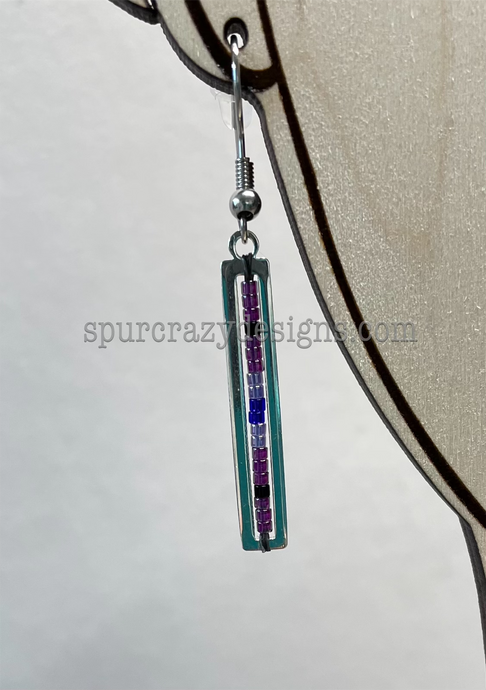 close up picture of purple bar earring