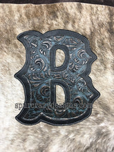 Load image into Gallery viewer, Caracol Plated Denim embossed leather and light brindle cowhide.